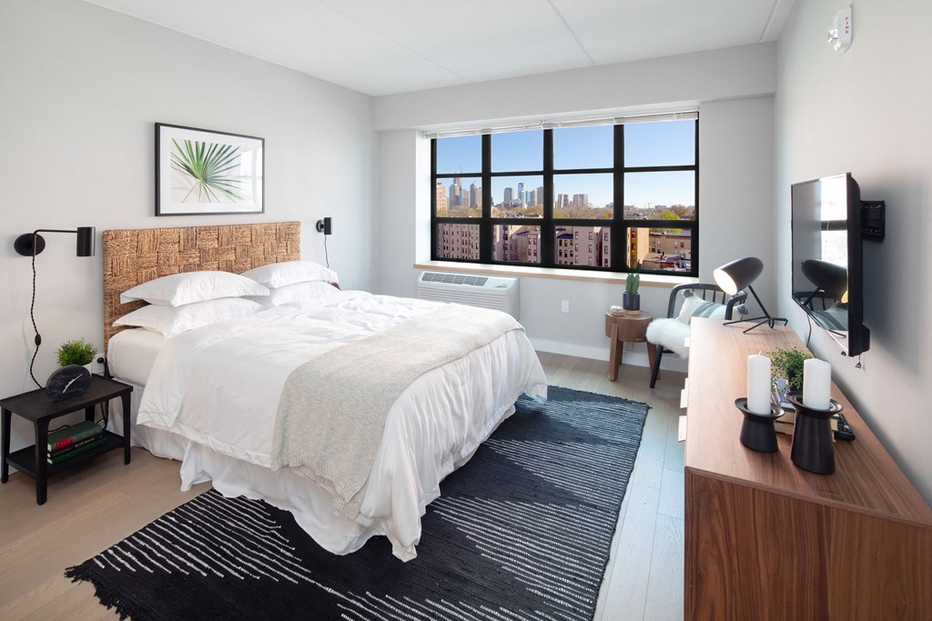 Revetment House Bedroom with Large grid style industrial window and well natural lighting.