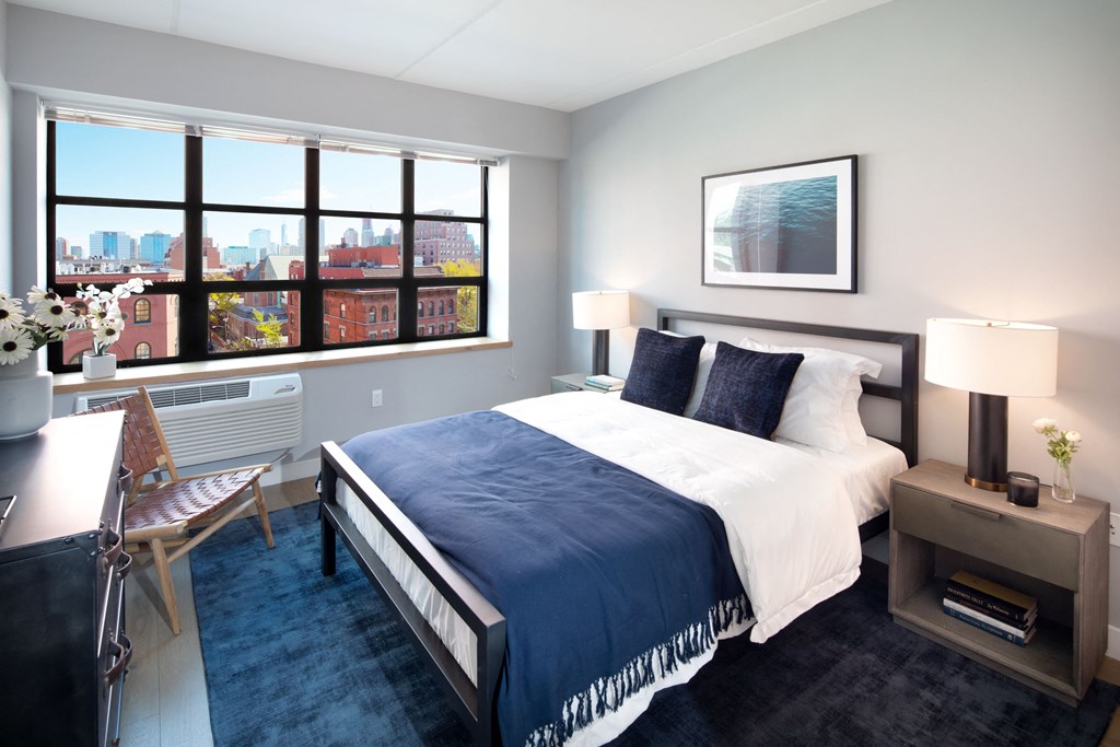 Revetment House bedroom with large window.