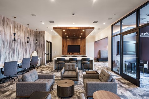 a living room with couches and chairs and a table and a television