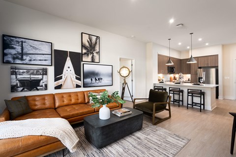 a living room with a leather couch and a coffee table