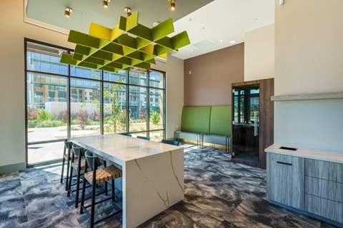 a dining room with a table and chairs and a large window