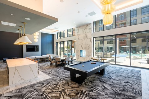 a pool table in the lobby of a building