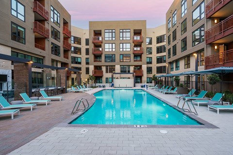 a swimming pool in the middle of an apartment building