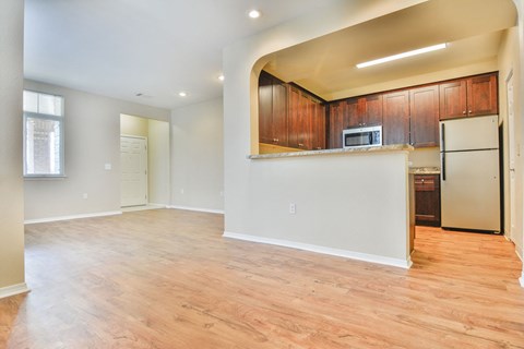A kitchen with wooden cabinets and a white countertop.