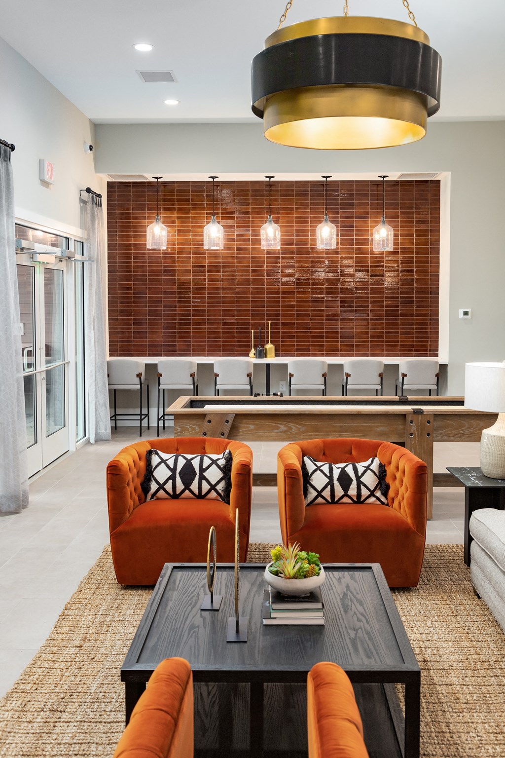 a living room filled with furniture and a large window