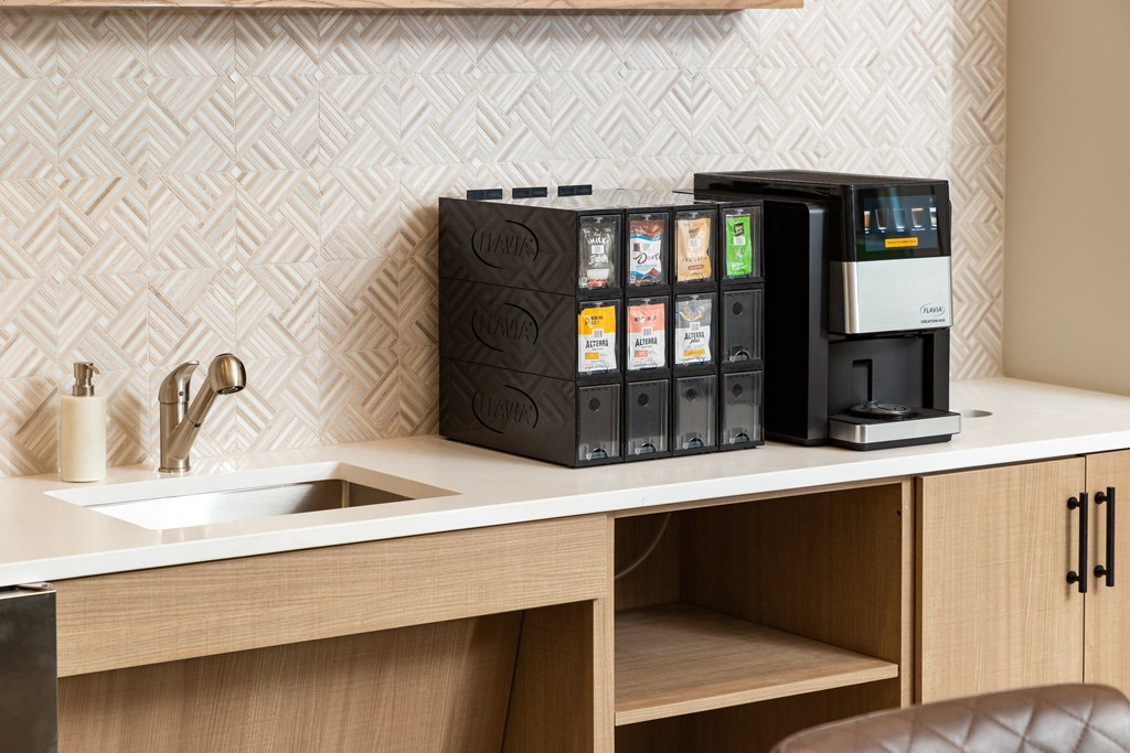 a coffee machine on a counter in a hotel room