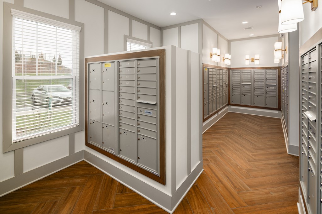 a large locker room with multiple lockers and windows