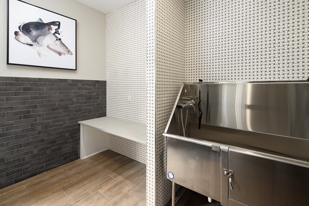 a small kitchenette with a sink and a bench
