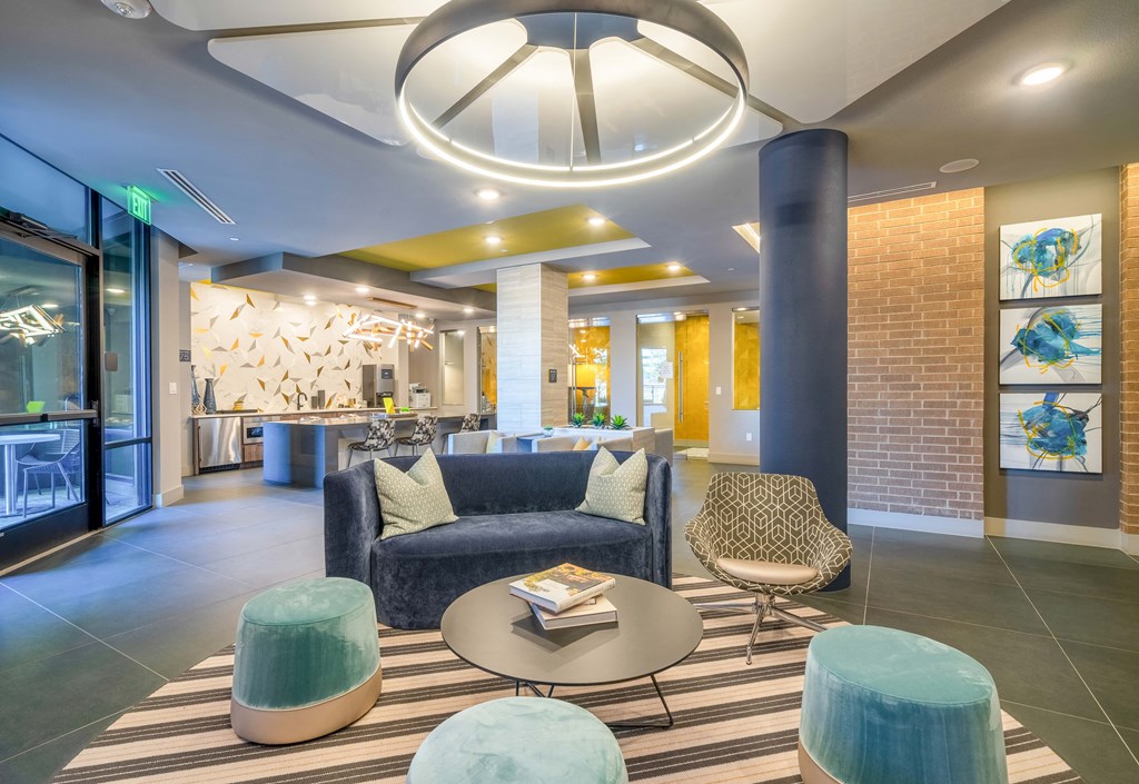 resident lounge with billiards, chairs, couch and table