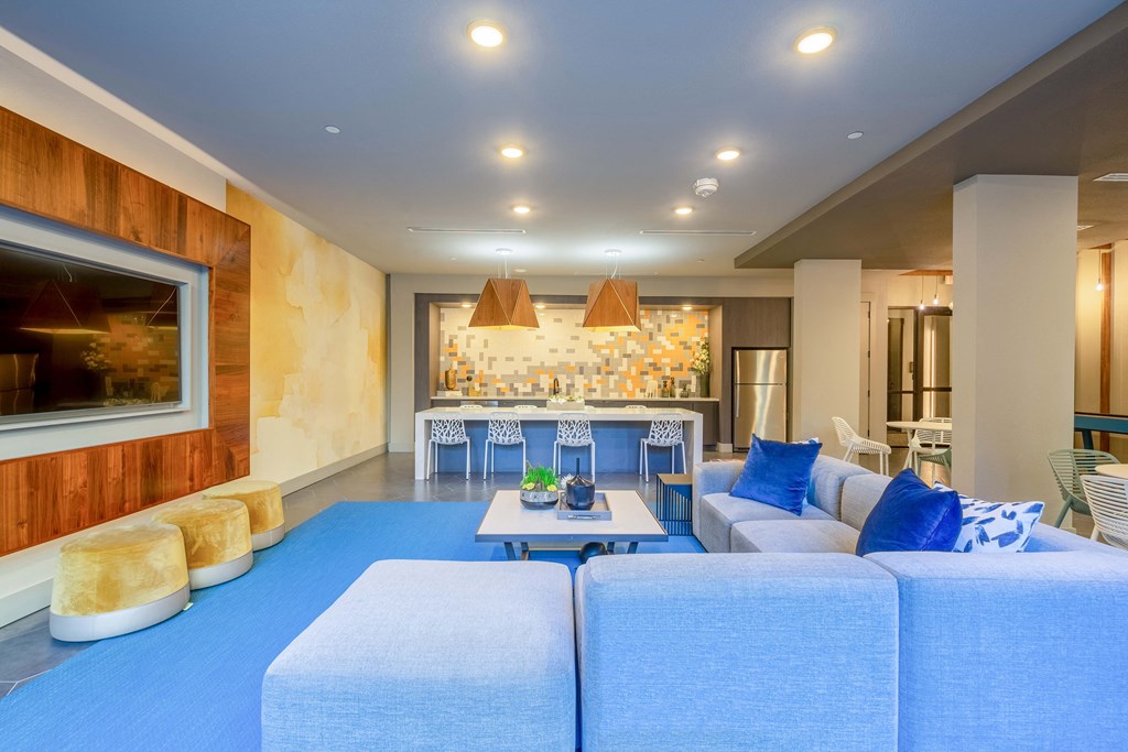 resident lounge with billiards, chairs, couch and table