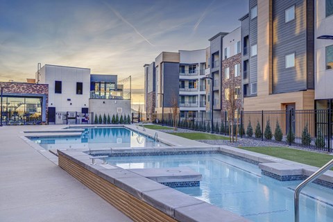 amenities include a pool and city buildings at the estates apartments