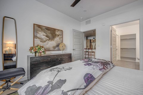 Bedroom with bathroom and closet space