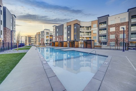 our apartments offer a swimming pool with our buildings in the background