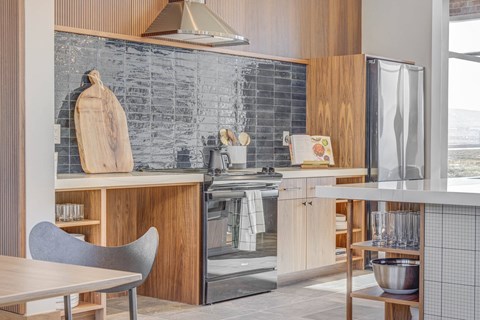 a kitchen with a stove and a refrigerator