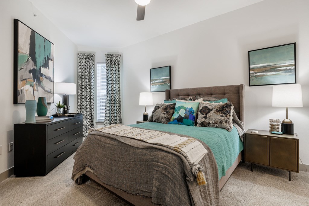 a bedroom with a bed and a dresser