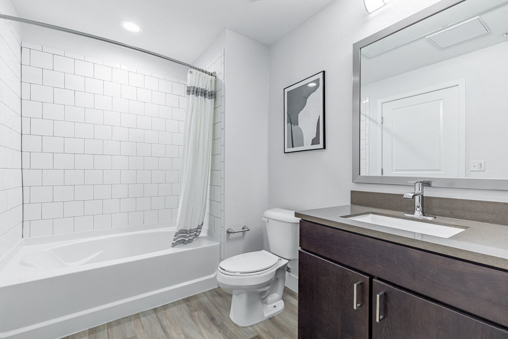 a bathroom with a toilet sink and bathtub