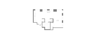 A floor plan of a small apartment with a living/dining area, kitchen, and bathroom.