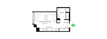 A floor plan of a small apartment with a living/sleeping area, kitchen, bathroom, and foyer.