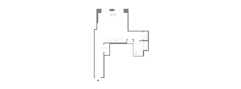 A floor plan of a building with multiple rooms and corridors.