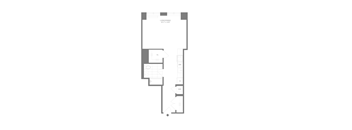 A floor plan of a building with multiple rooms and a staircase.
