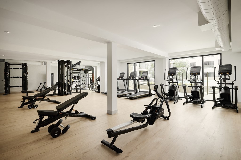 a room filled with lots of different types of exercise equipment