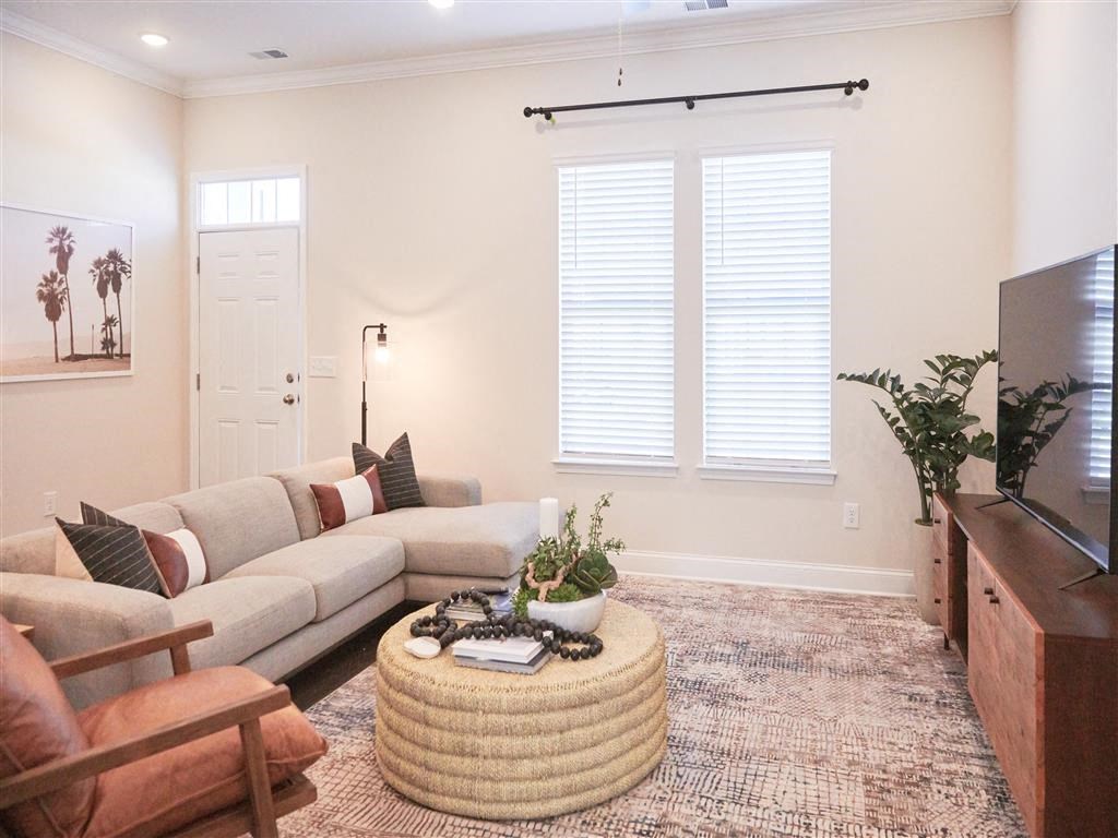 a living room with a couch and a tv