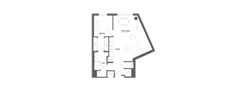 A floor plan of a house with a bedroom, living/dining area, kitchen, bath, and laundry room.