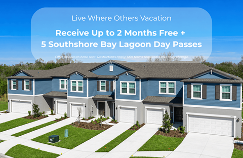 A blue house with a sign offering free months and lagoon passes.