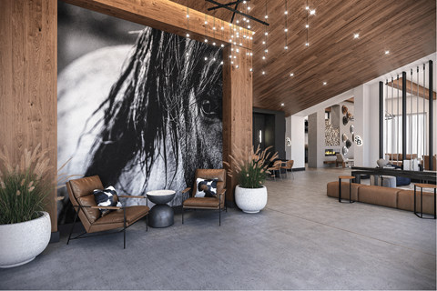 A modern living room with a large black and white mural on the wall.