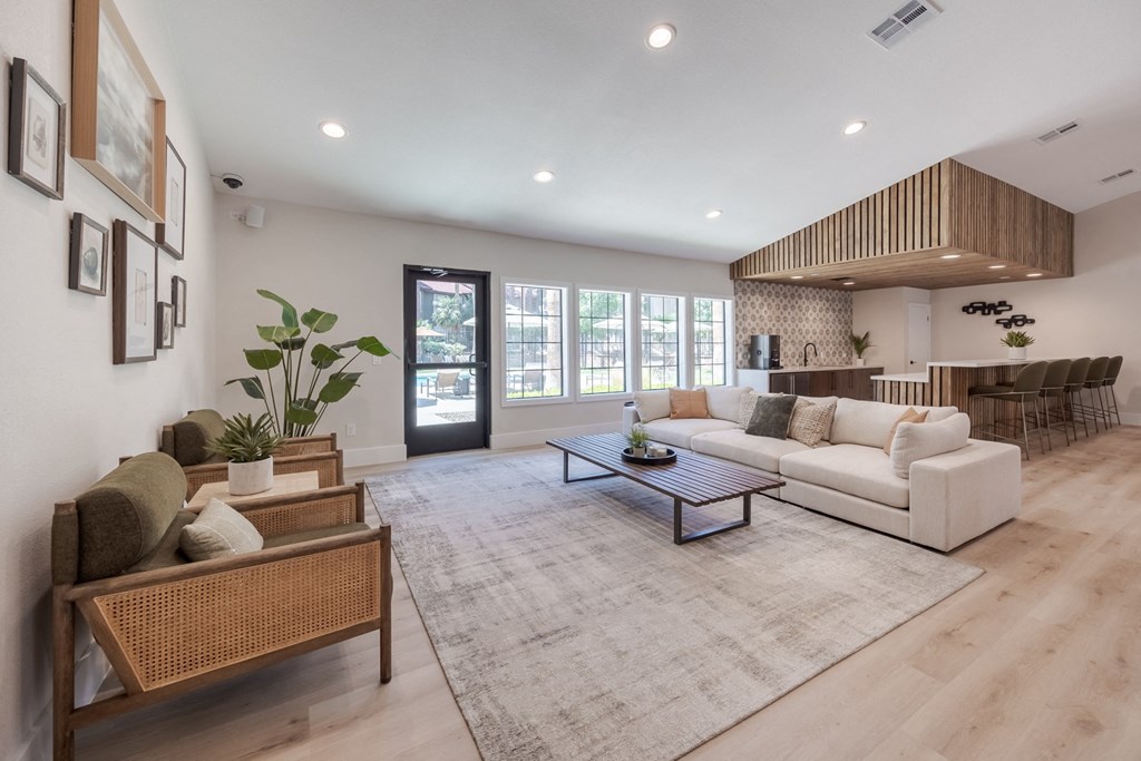 a living room with a white couch and a table