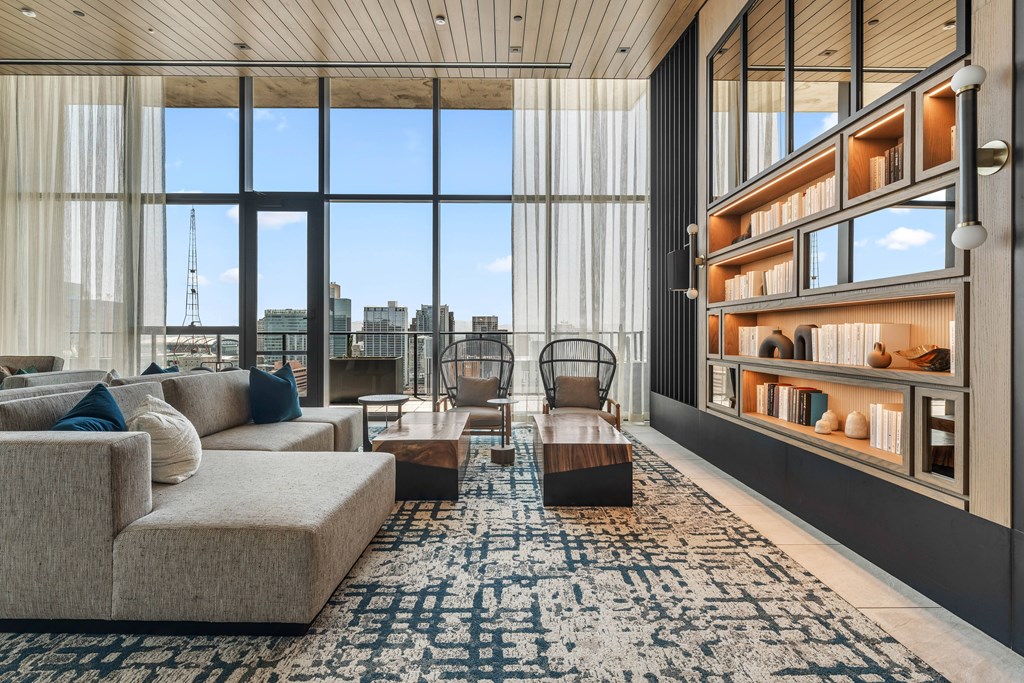 Modern club room with a view of the city skyline.