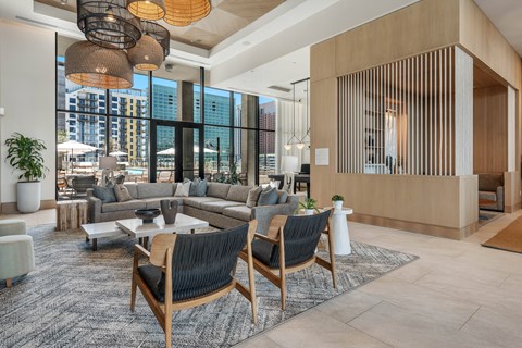 Interior club room with a large window overlooking the city.