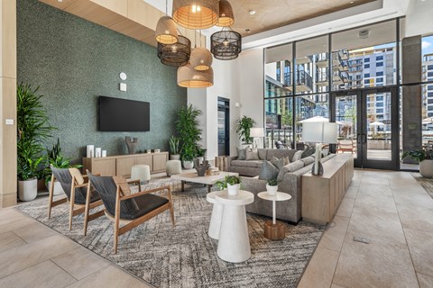 Interior club room with ceiling fixture, tile flooring, furnished