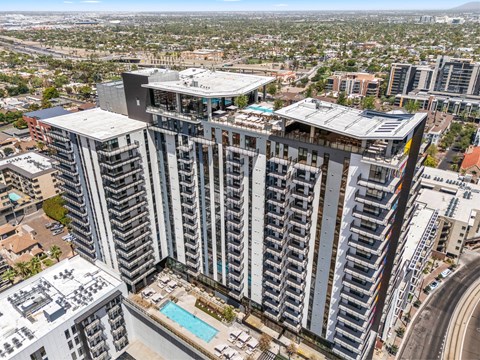 A large, modern building with a pool in the middle of it.