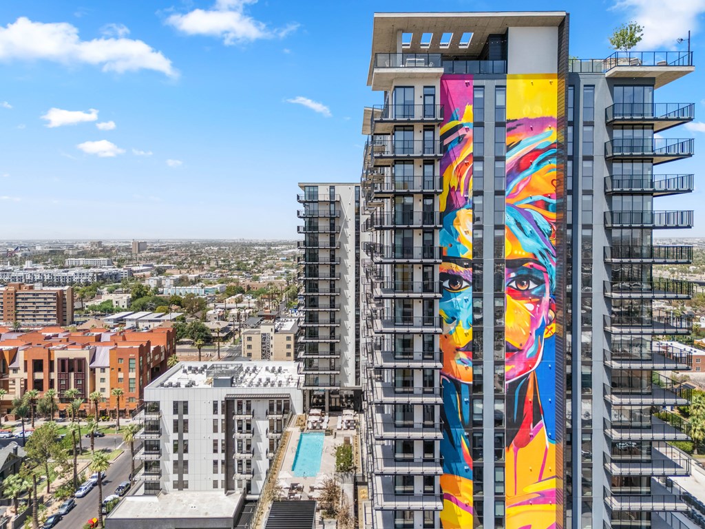 Exterior building with a mural painted on its side.