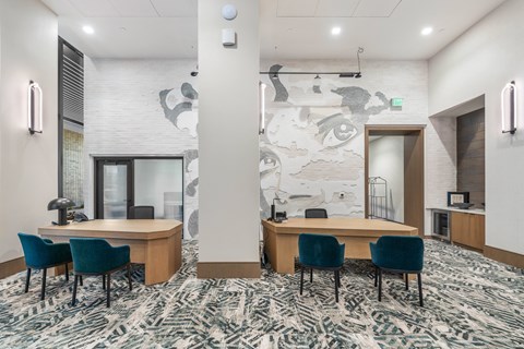 A conference room with a large table and chairs.