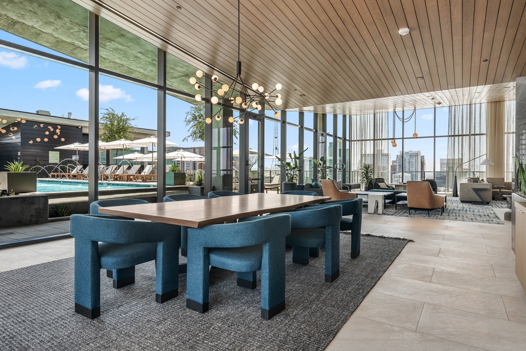 A large conference room with a long table and chairs.