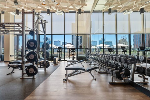 A gym with a view of the city.