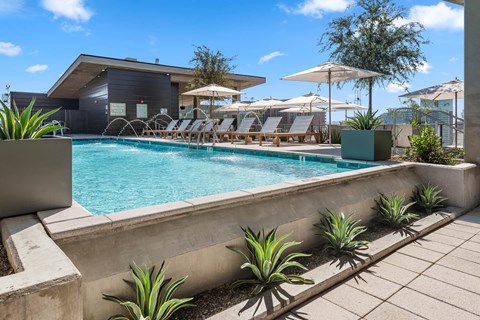 Exterior pool area with lounge seating