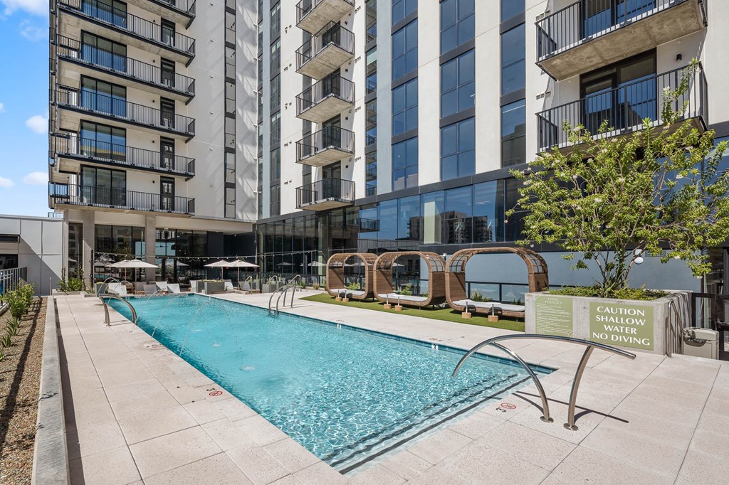 Exterior building with pool and lounge seating