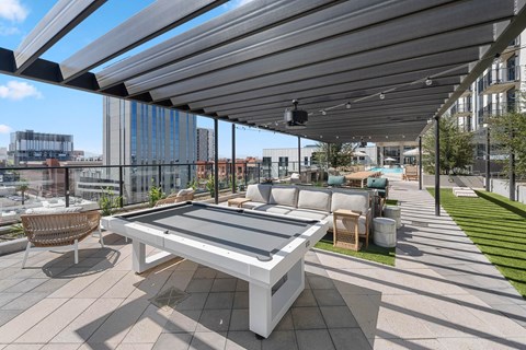 exteriour outdoor pool lounge with pool table, outdoor games, lounge seating