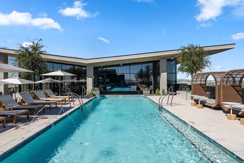 Exterior pool with lounge seating