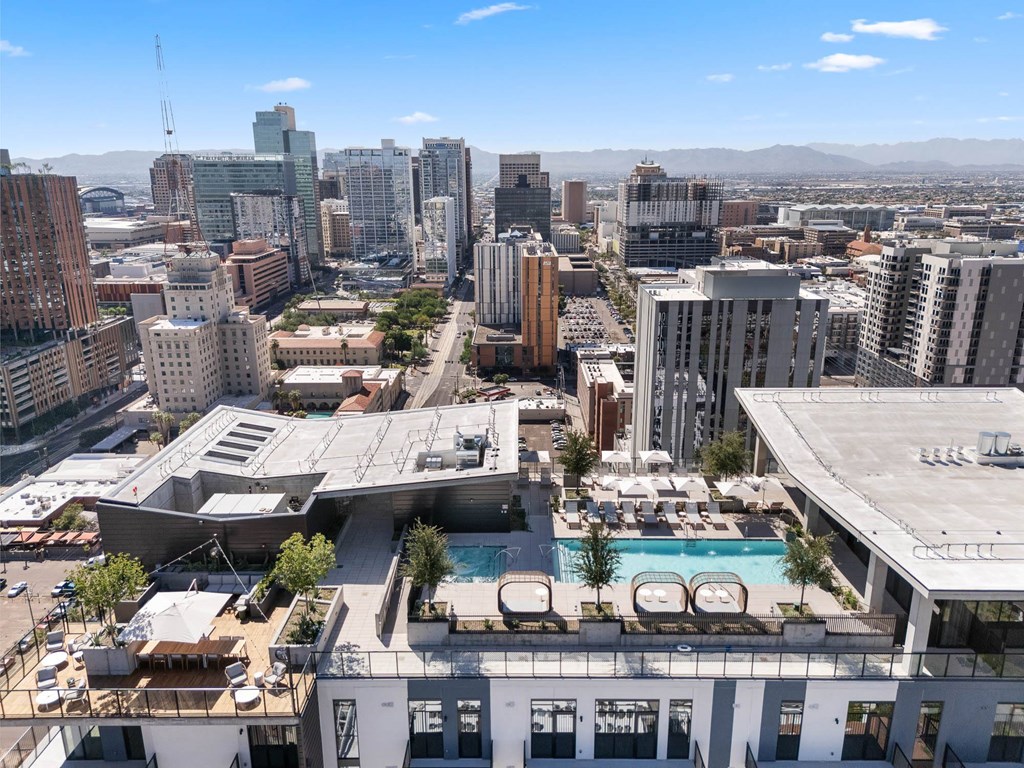 Roof-top exterior birds-eye view of the pool and lounge area