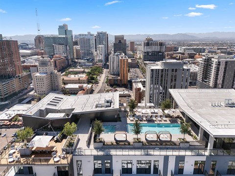 Roof-top exterior birds-eye view of the pool and lounge area