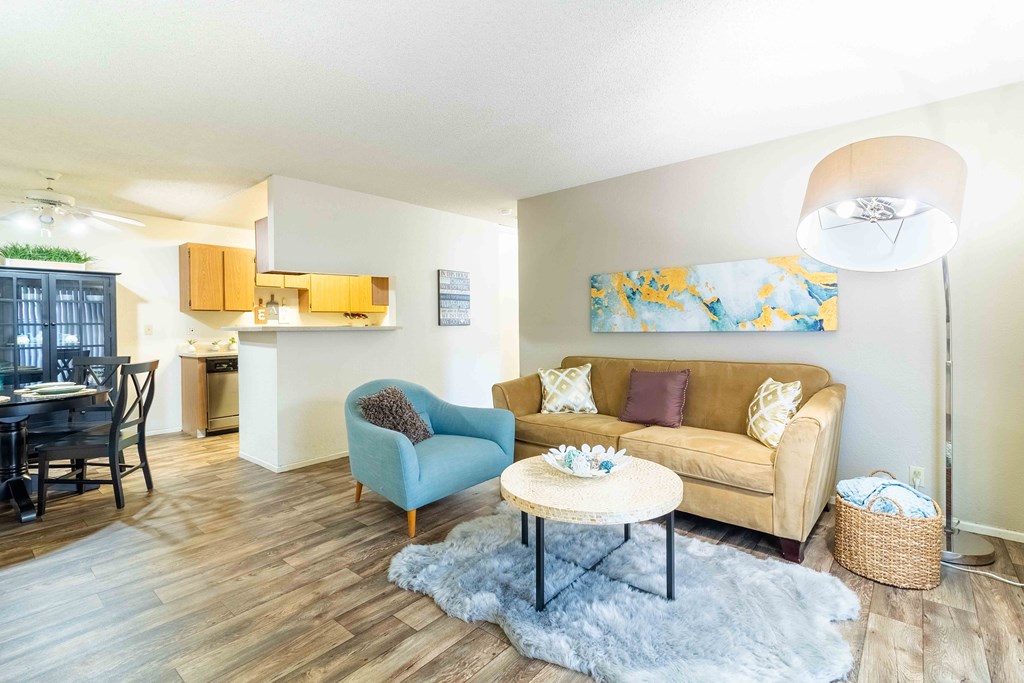 A living room with a couch, chair, and coffee table.