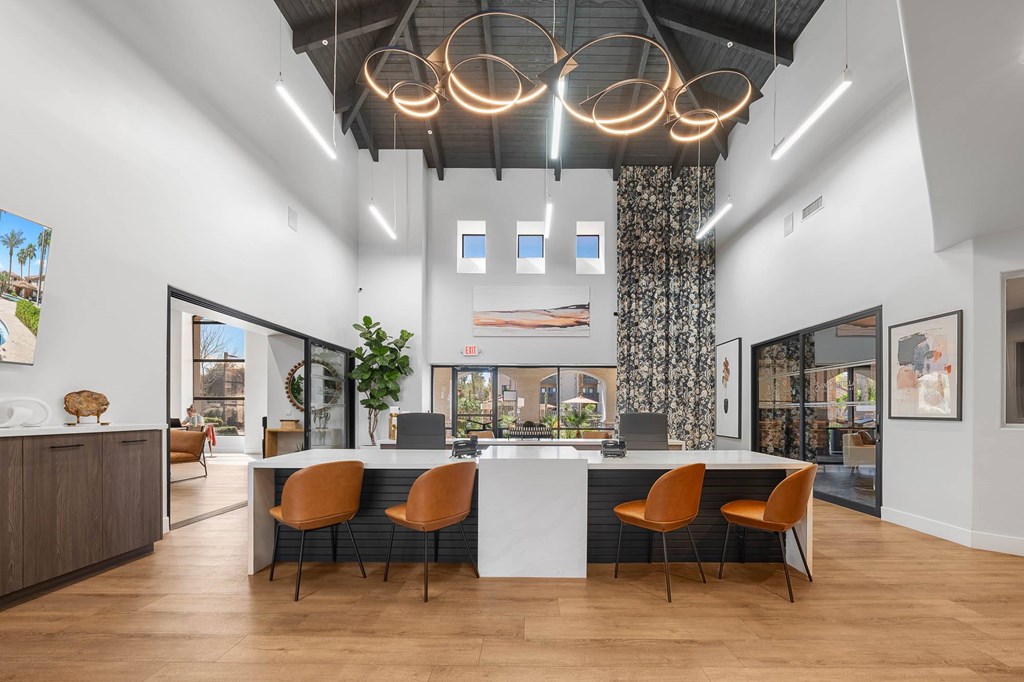 A modern office space with a long table and chairs.