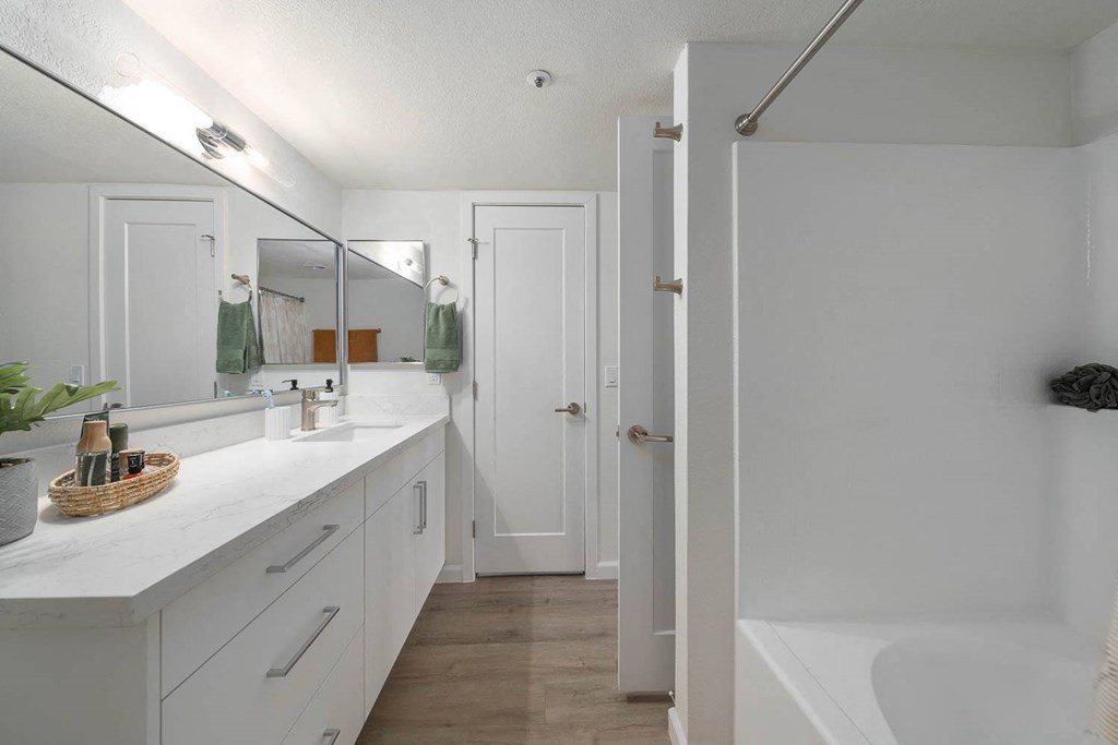 a room with a bunch of white chairs and a table