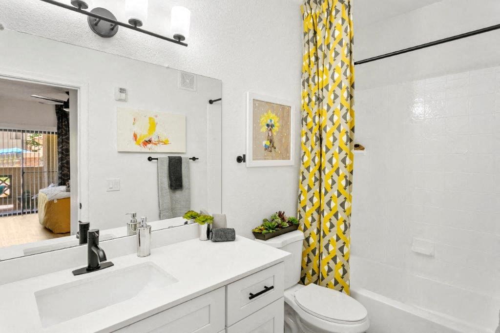 San Portella, Tempe, AZ, Bathroom A bathroom with a white sink and a yellow curtain.