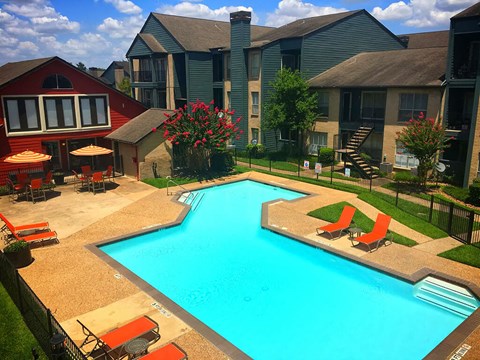 Community pool with lounge chairs