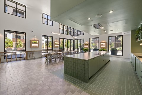 A kitchen with a large island in the middle of the room.